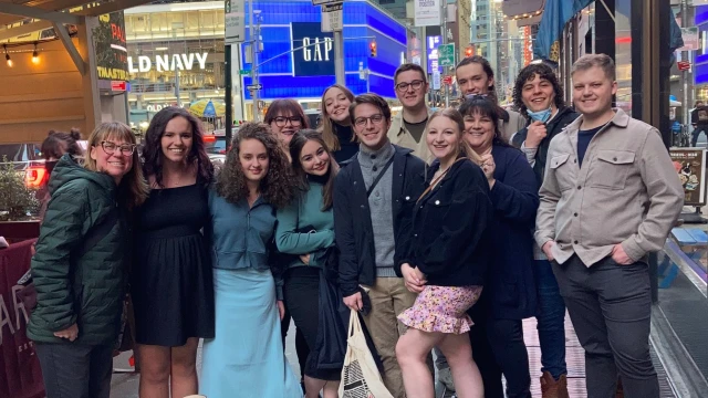 Journalism students pose for a group photo on a New York City at the College Media Association conference.