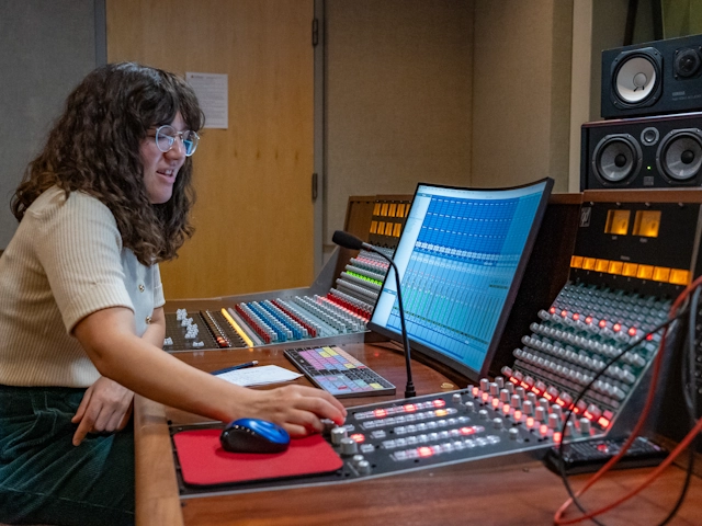 Student at a soundboard