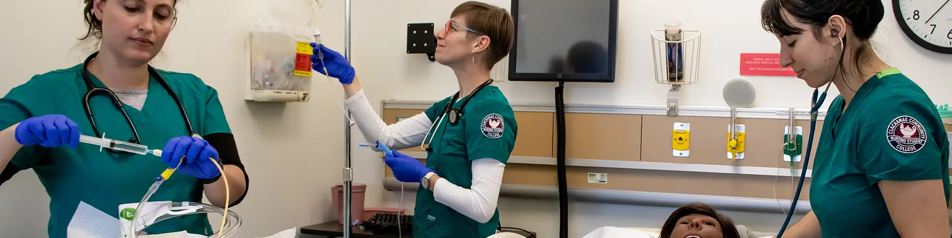Clackamas Community College nursing students practice procedures in a simulated health care setting