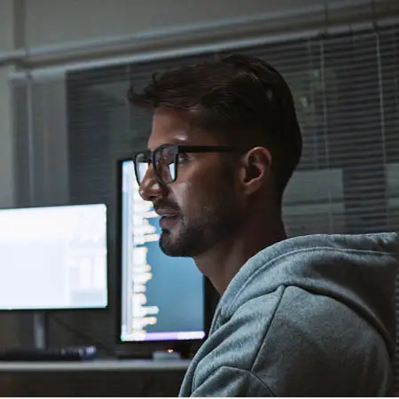 Person looking at a computer screen in an office
